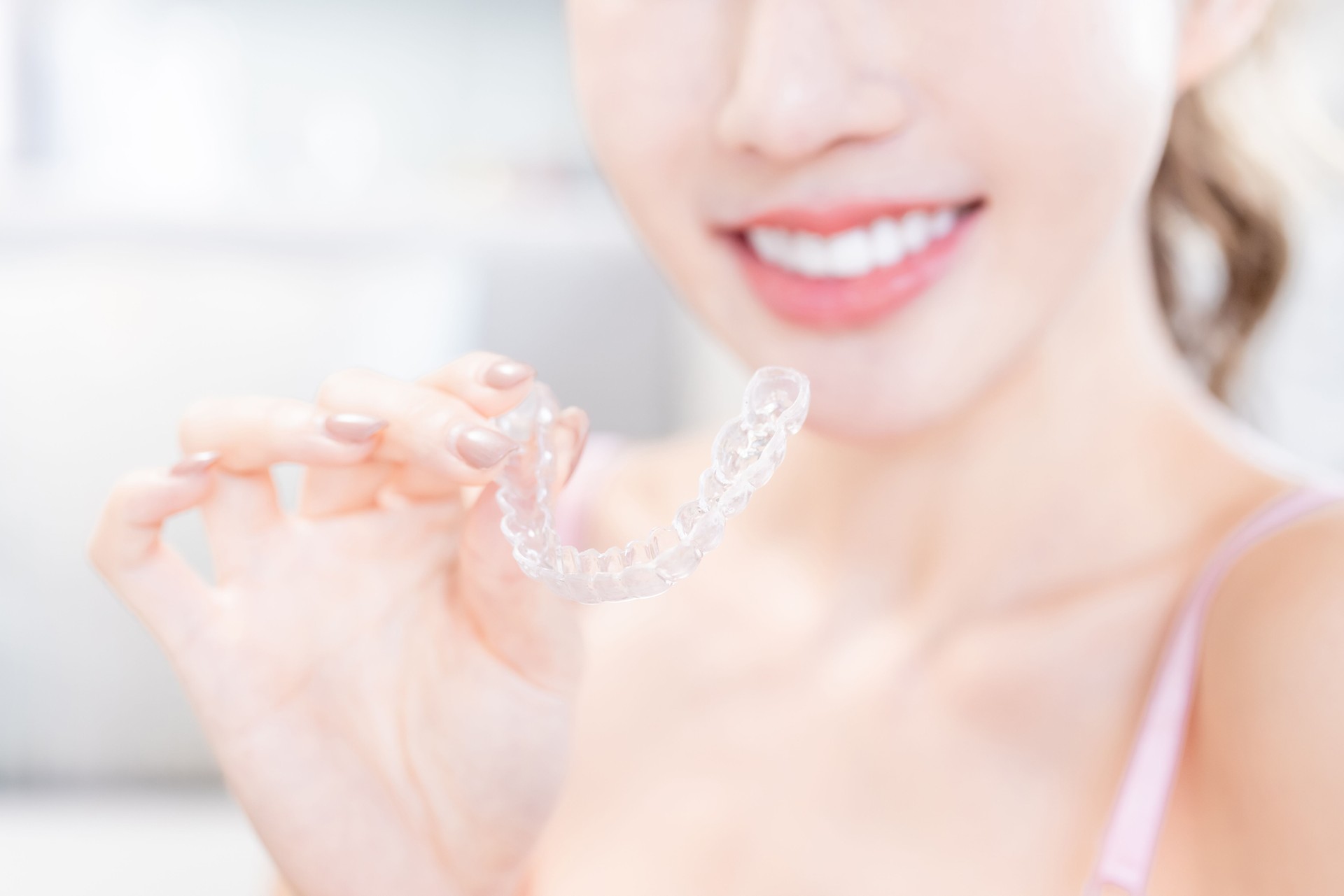 woman with retainer for teeth